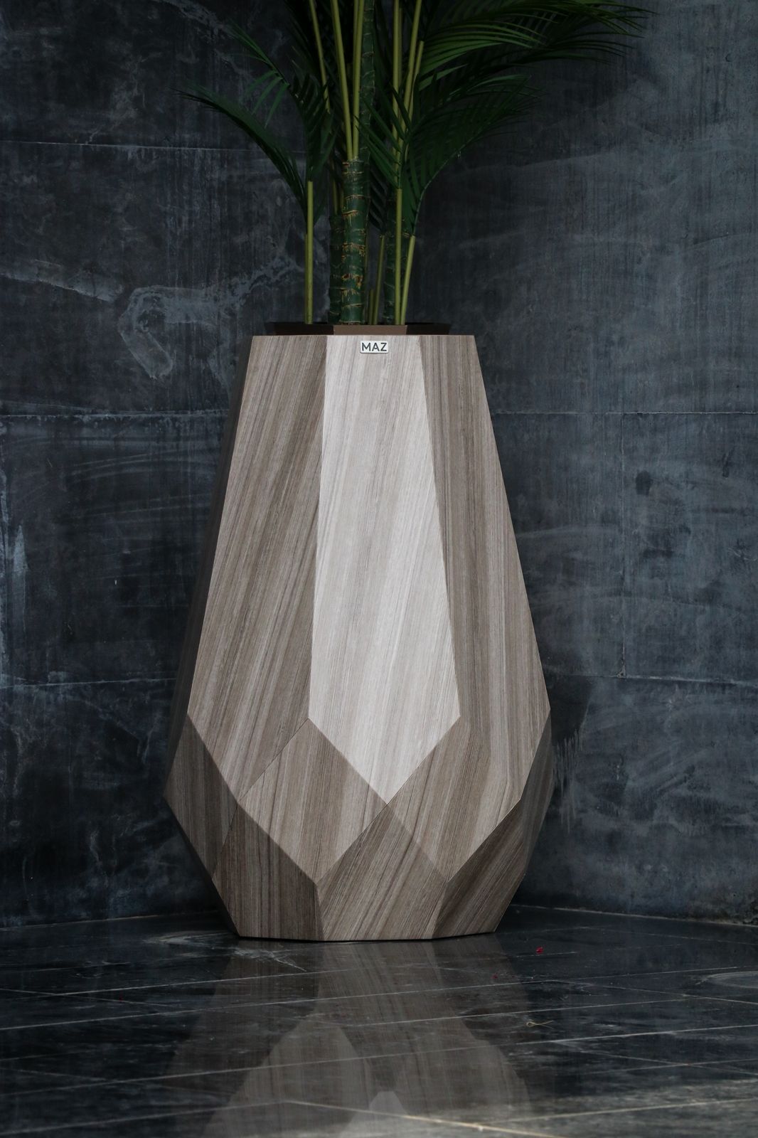 MAZ faceted stone-finish planter detail
